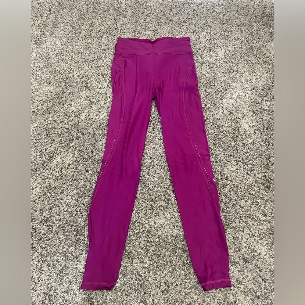 Never worn- lulu lemon insulated magenta leggings size 6